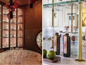 Cocina-bar del Espacio SixtyPro y módulo de almacenaje del Espacio Schmidt en Casa Decor 2026 con botellas, mixers y copas de LE Tribute integrados en la decoración.